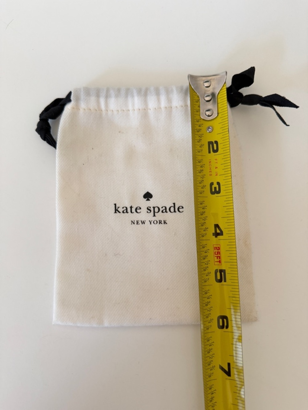 kate spade White Drawstring Logo Pouch with Black Ribbon
